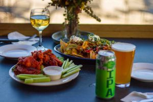 wings nachos beer ipa and wine on the table at the lost paddle at ace adventure resort beside wonderland waterpark