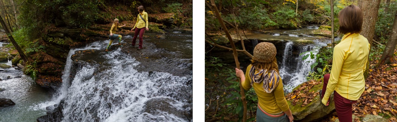 Two women hike through native plants and waterfalls along a trail at ACE Adventure Resort in West Virginia.