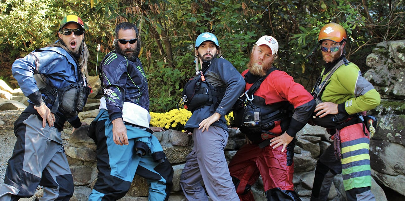 Fall Gauley season guides strike a pose on the riverside after an overnight Gauley rafting and camping trip on the Gauley River in West Virginia with ACE Adventure Resort.