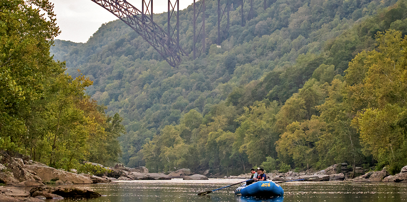 New River fishing in an oar boat under the New River Bridge with ACE Adventure Resort in West Virginia.