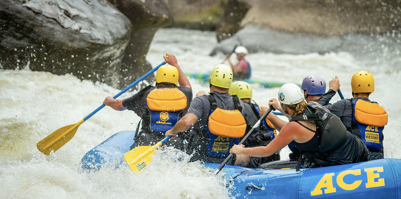 Raft guide Jenn Sapio lines up at Pillow Rock, a Class V rapid on the Upper Gauley River on a rafting trip with ACE Adventure Resort in West Virginia.