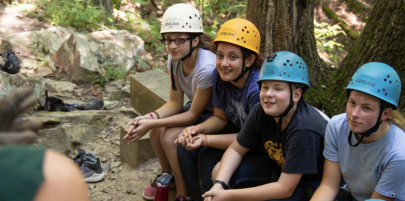 A group of STEM students study geology with rock climbing in ACE Adventure Resort's outdoor classroom in the New River Gorge.