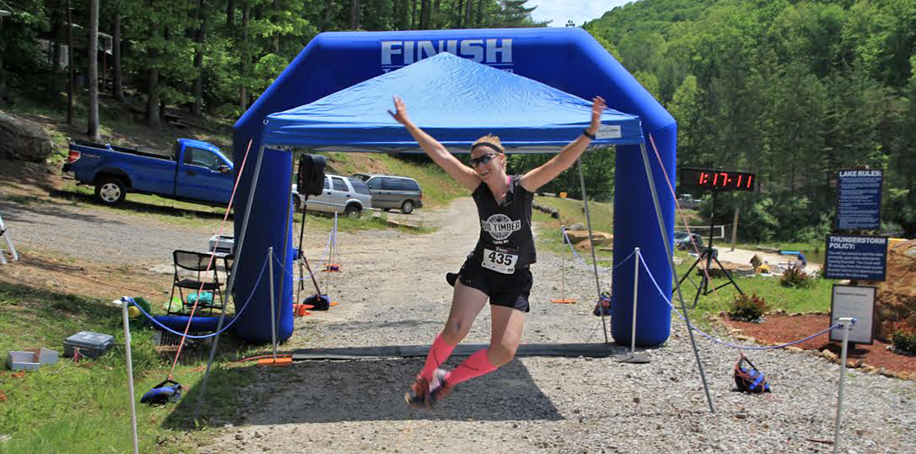 A runner crosses the finish line at the Wonderland Mountain Challenge at ACE Adventure Resort in Southern West Virginia.