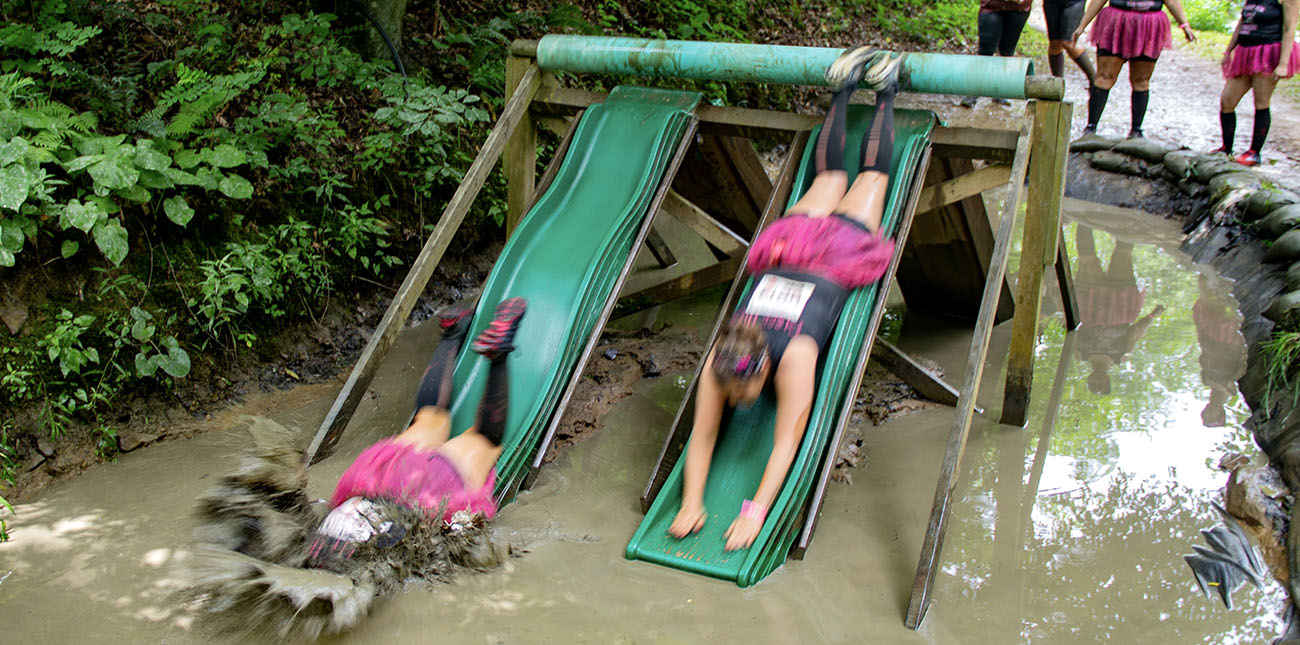 Contestants attack the mud slides during the 2018 Gritty Chix Mud Run at ACE Adventure Resort.
