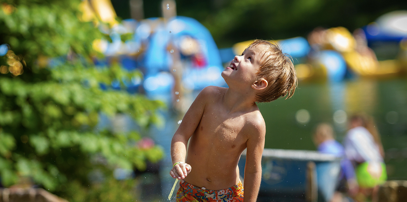 Playing on the splash pad at Wonderland Waterpark at ACE Adventure Resort.