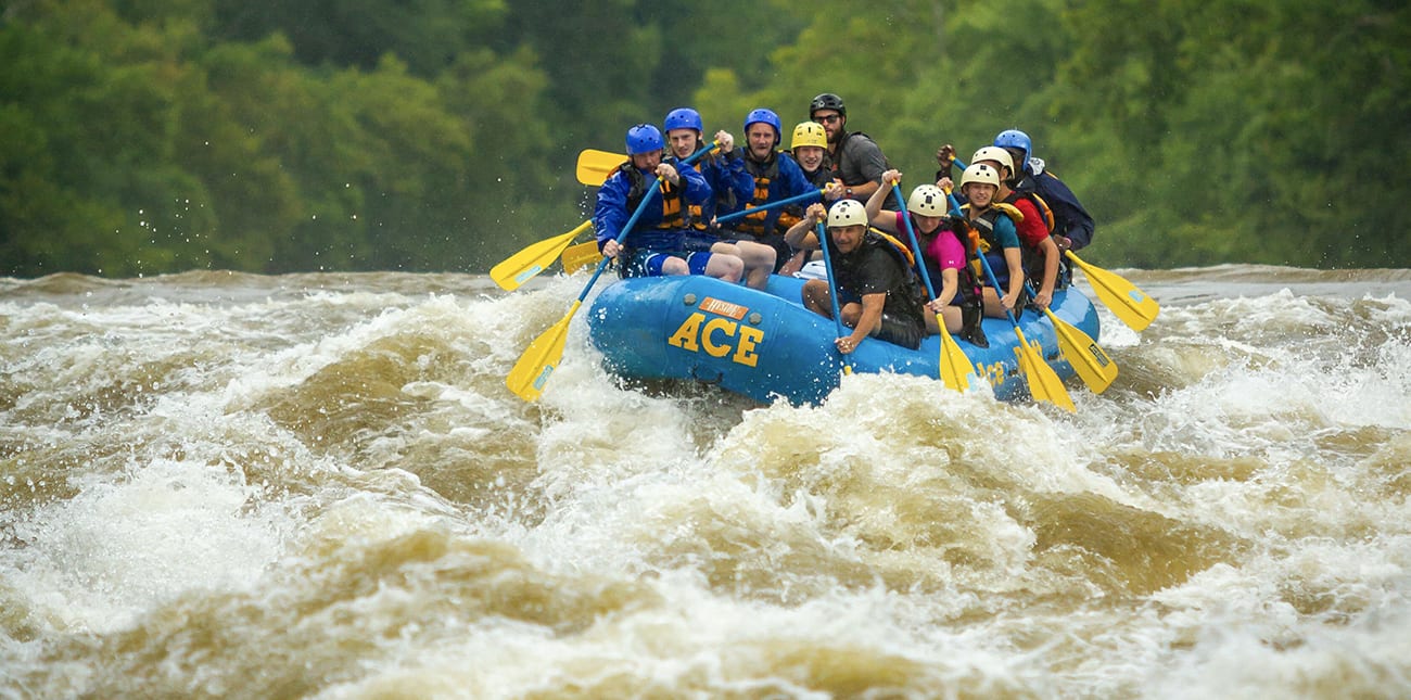 Rafters take on the massive spring flows on a lower new river gorge white water rafting trip in the new river gorge national park in west virginia.