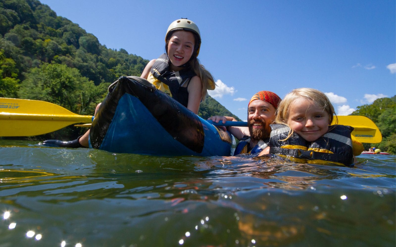 A family enjoys white water rafting west virginia style on the upper new river gorge.