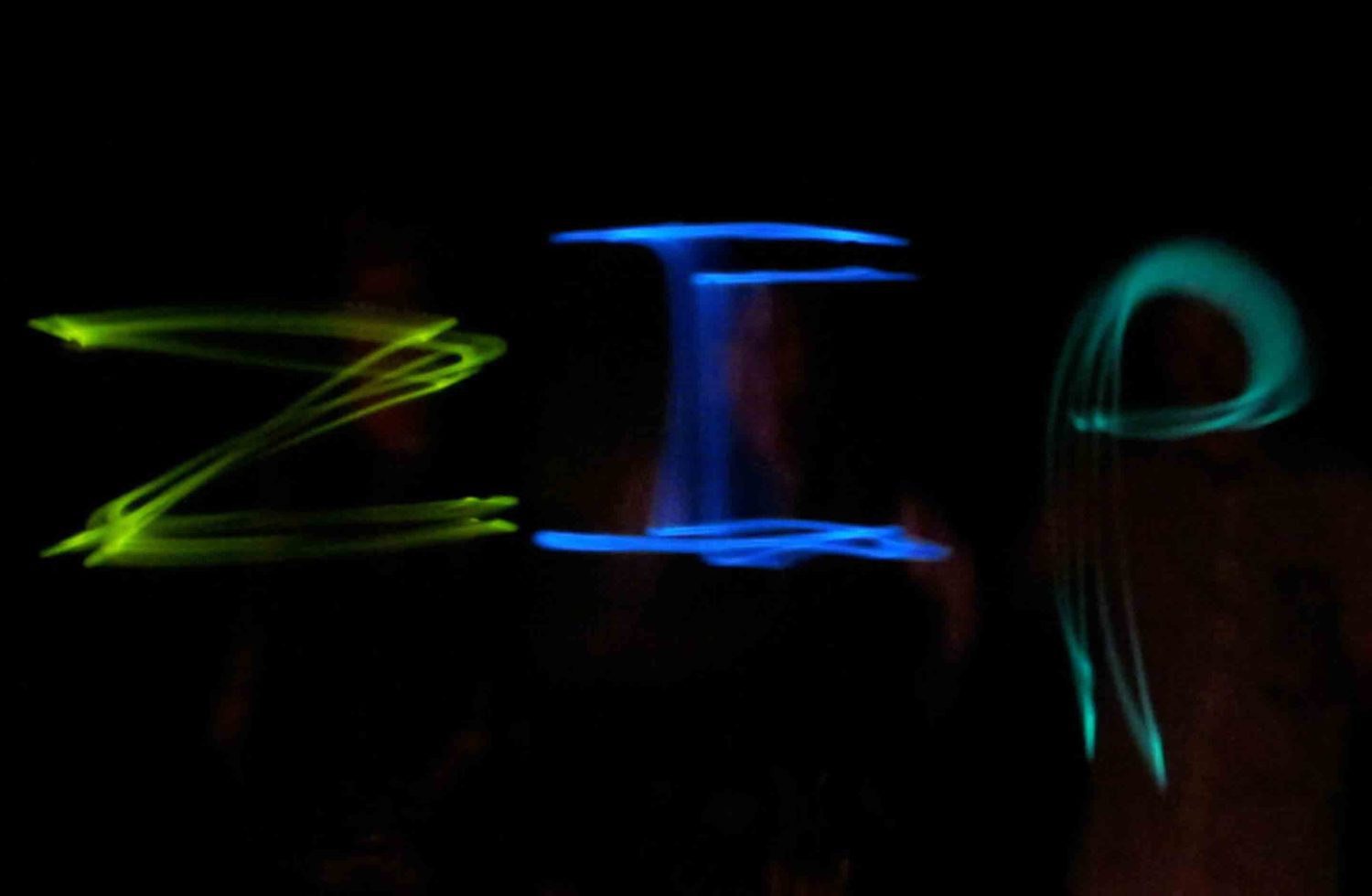 Playing with light in the dark on a night time zip line trip at ACE Adventure Resort.