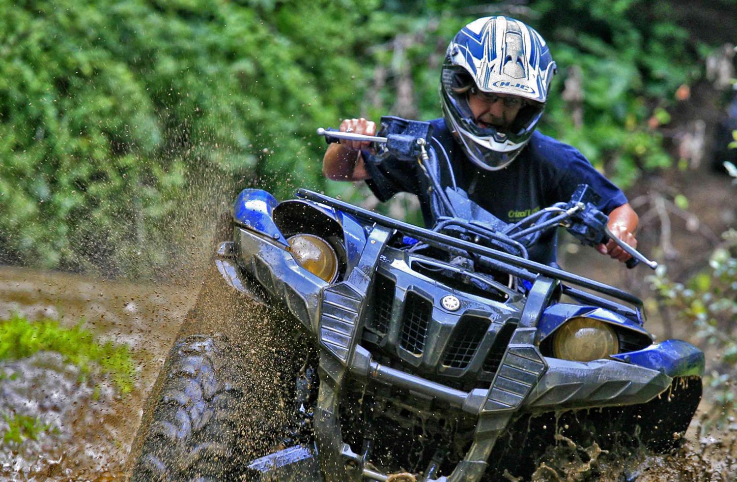 Photo of a Young Man Muddin' on One of the Wildest West Virginia ATV Trails.