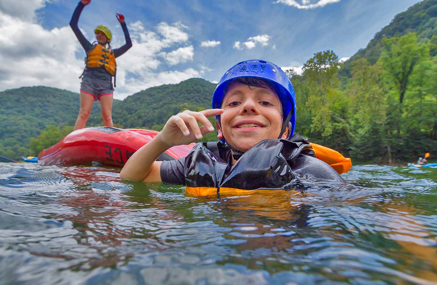Two members of Scouts BSA have fun in the water upper new rafting in west virginia,
