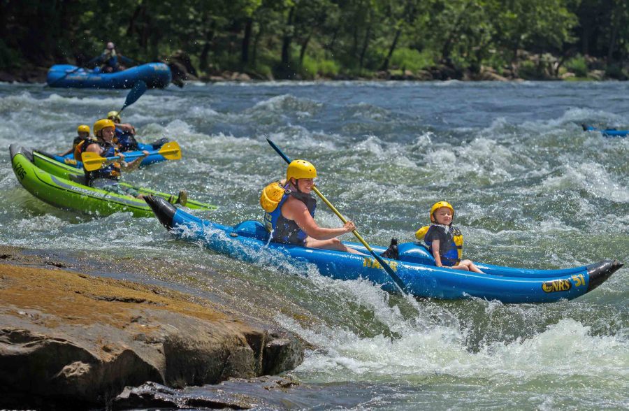 Kids and parents kayak together on the Upper New River with ACE Adventure Resort.