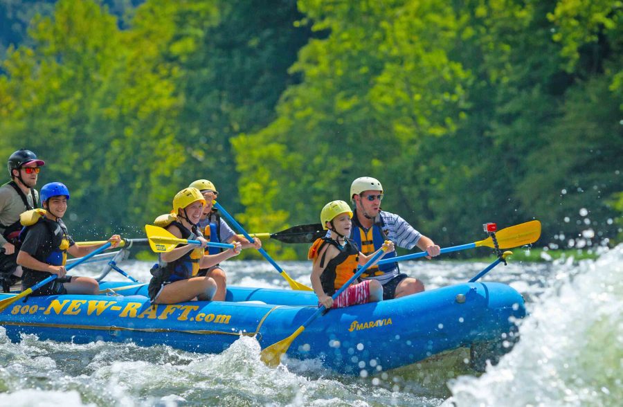 A family paddles the Upper New River with ACE Adventure Resort.