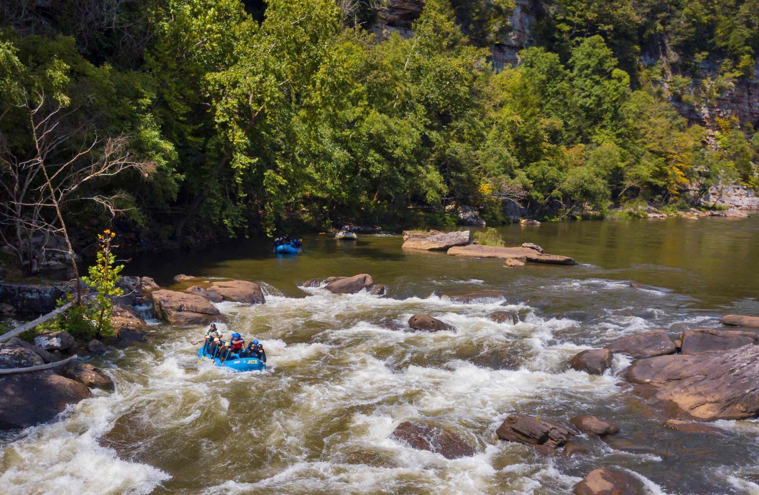 An ACE Adventure Resort raft enters Junkyard Rapid on a Lower Gauley rafting trip in West Virginia.
