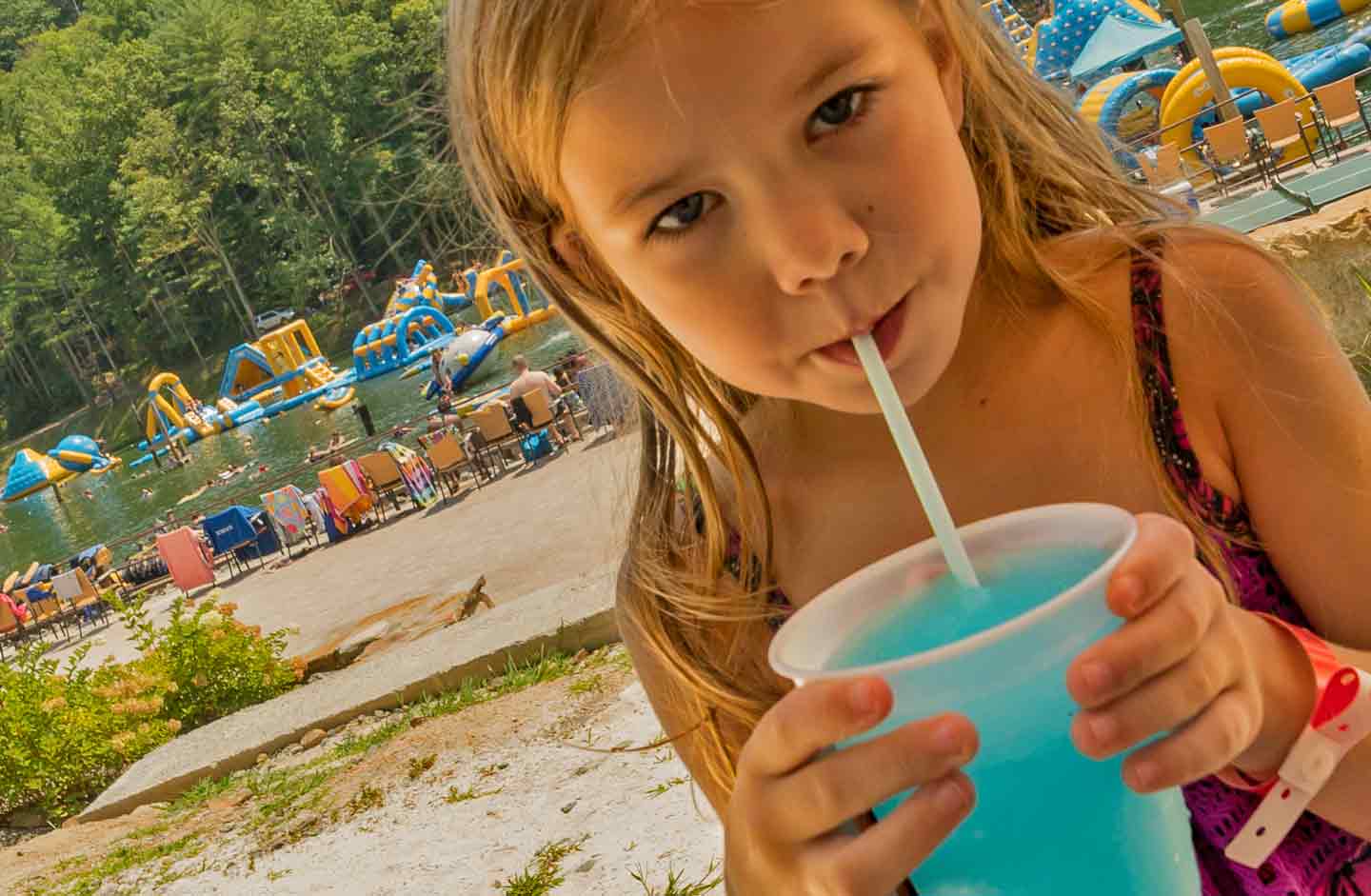 Photo of a Young Girl Sipping on a Slurpie at Our Family Adventure Resort.