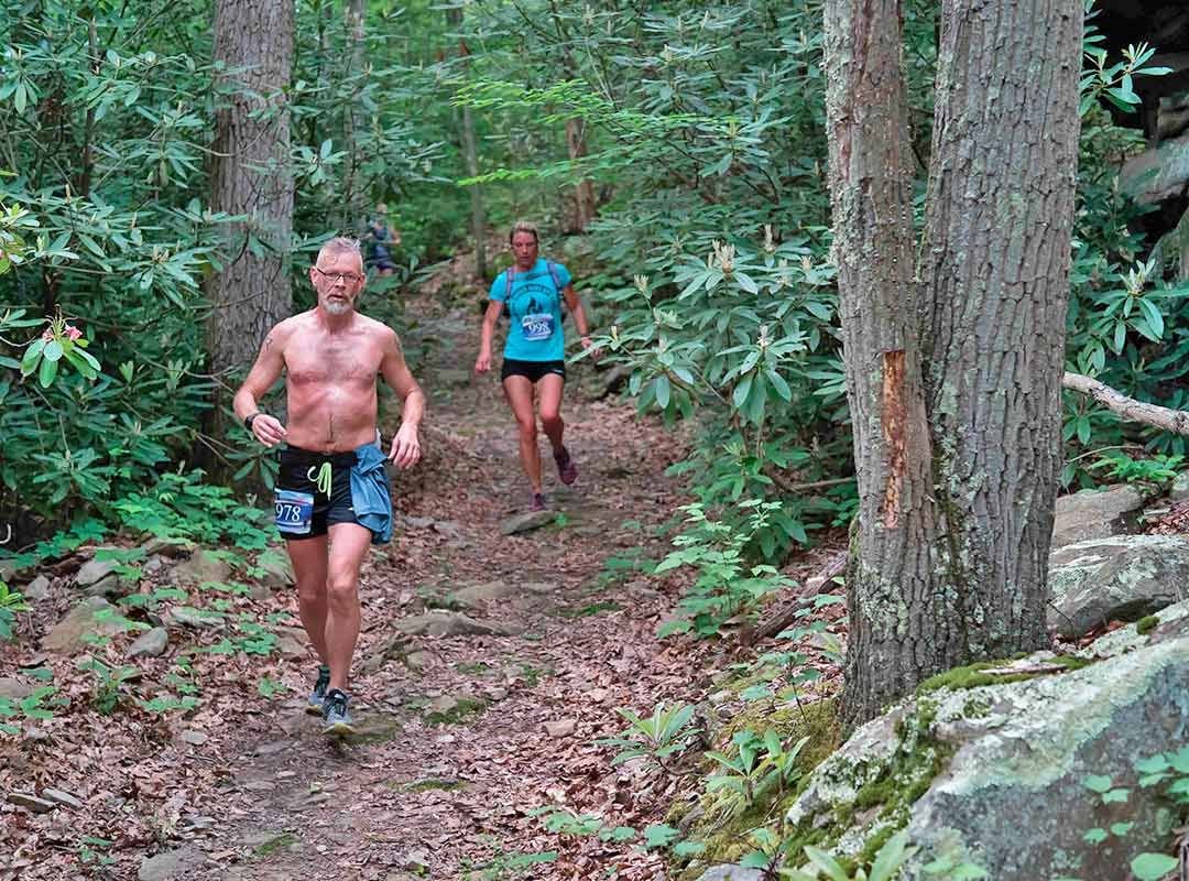 Runner in Woods with Rocks