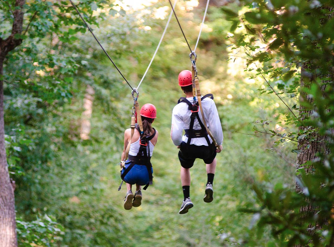 Couple ziplining 