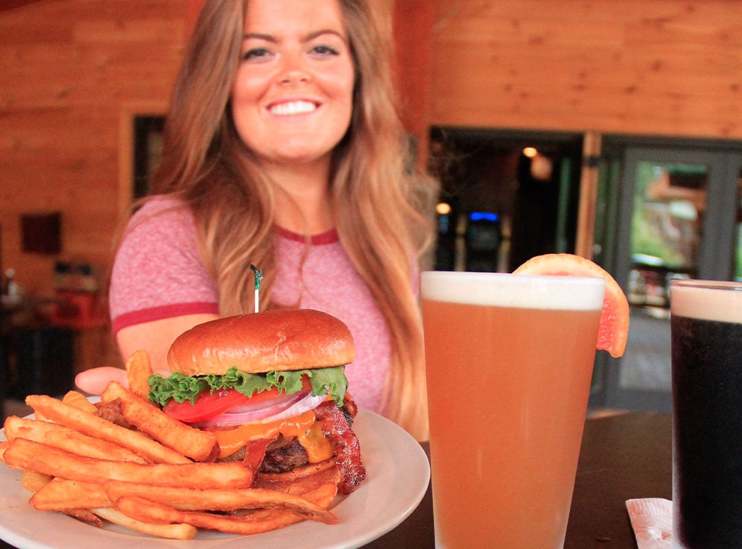 Waitress with food and drinks