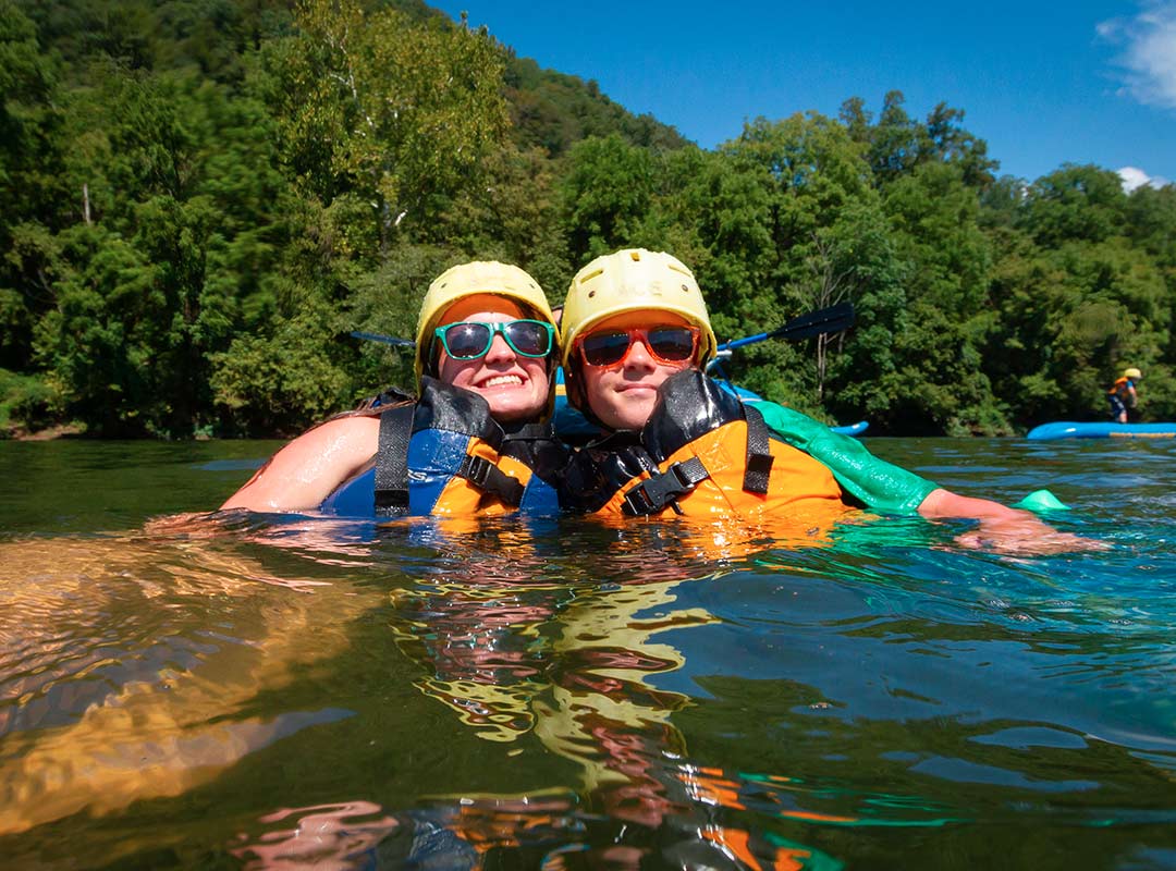 guests enjoying the river