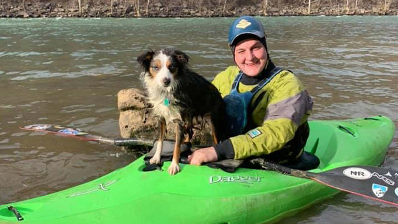 Chris Colin kayaking with his dog