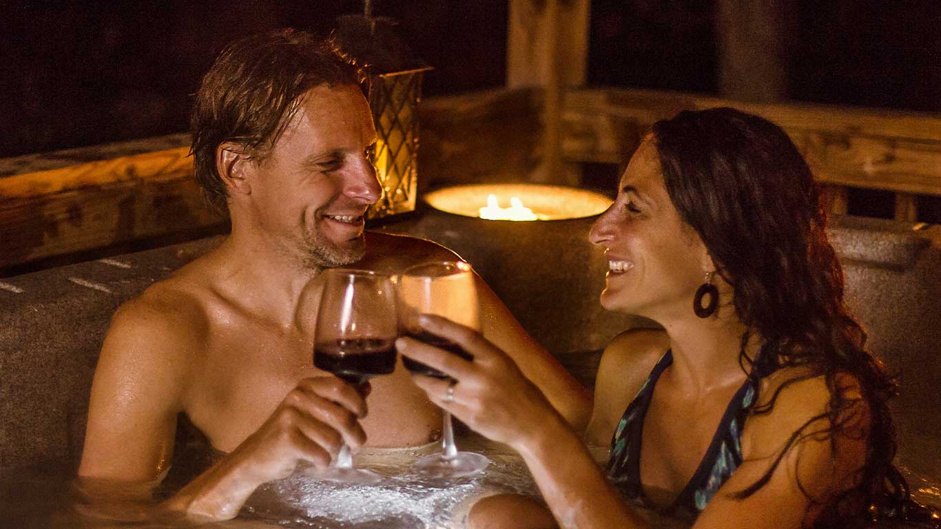 Couple enjoying hot tub for Valentine's Day Weekend