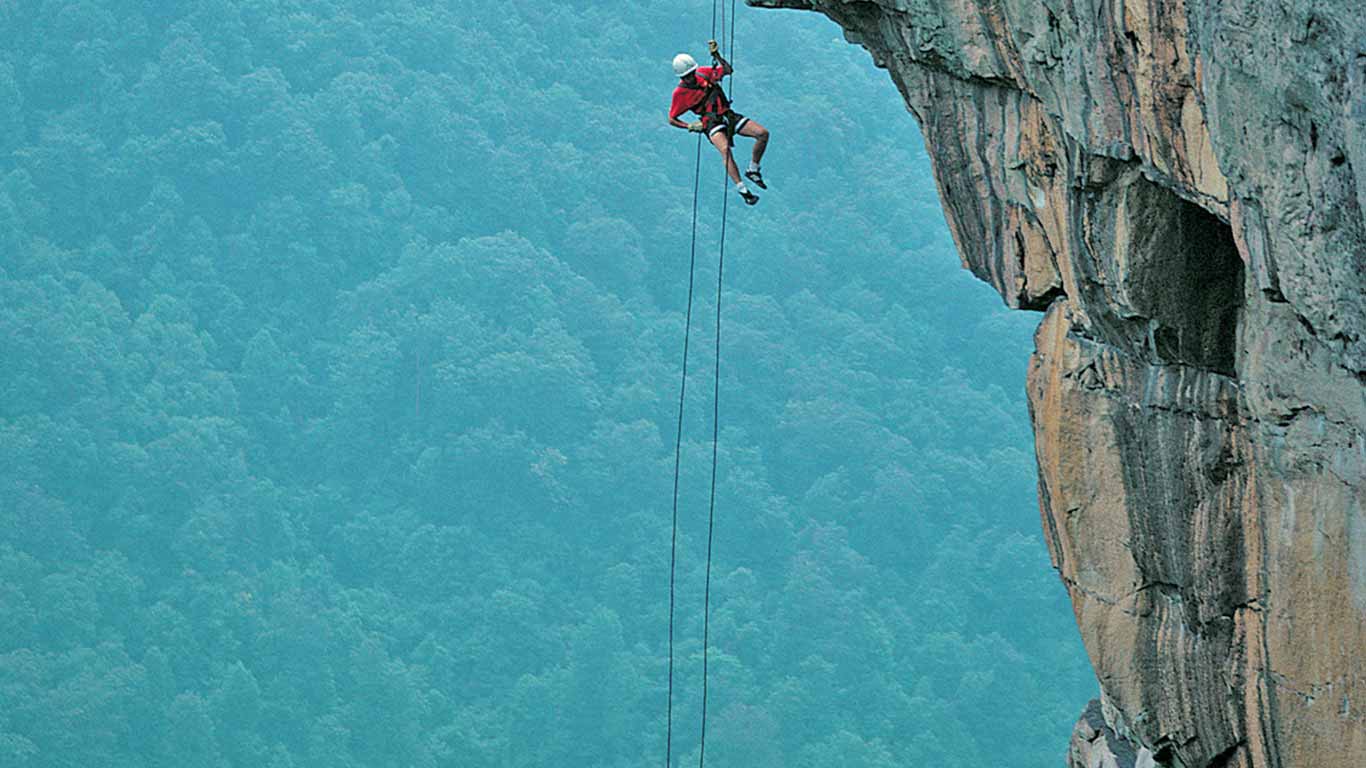 Guest rappelling with ACE Adventure Resort