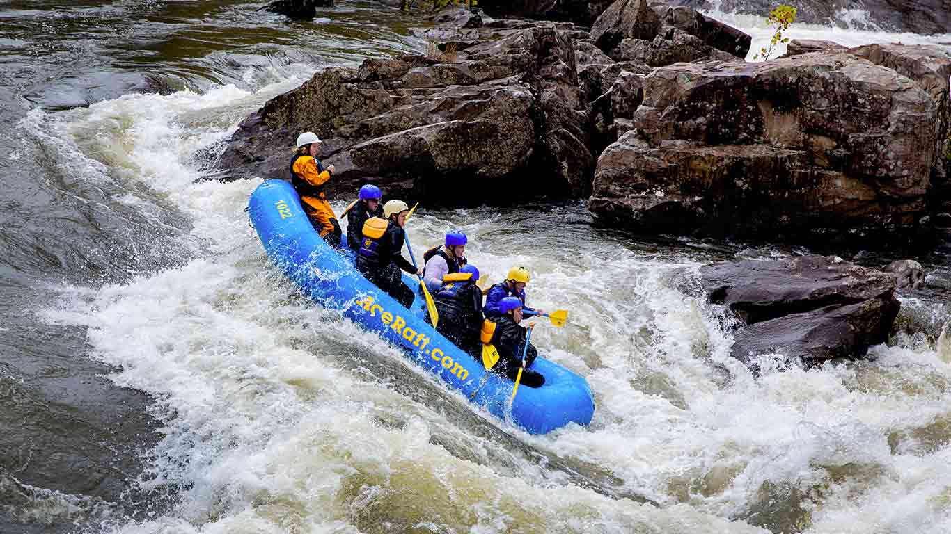 Group river rafting the Upper Gauley during fall gauley season