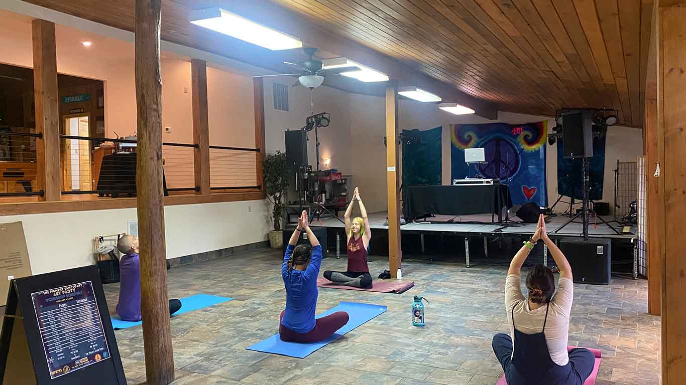 Guests doing yoga at Pigment Sanctuary Art Party