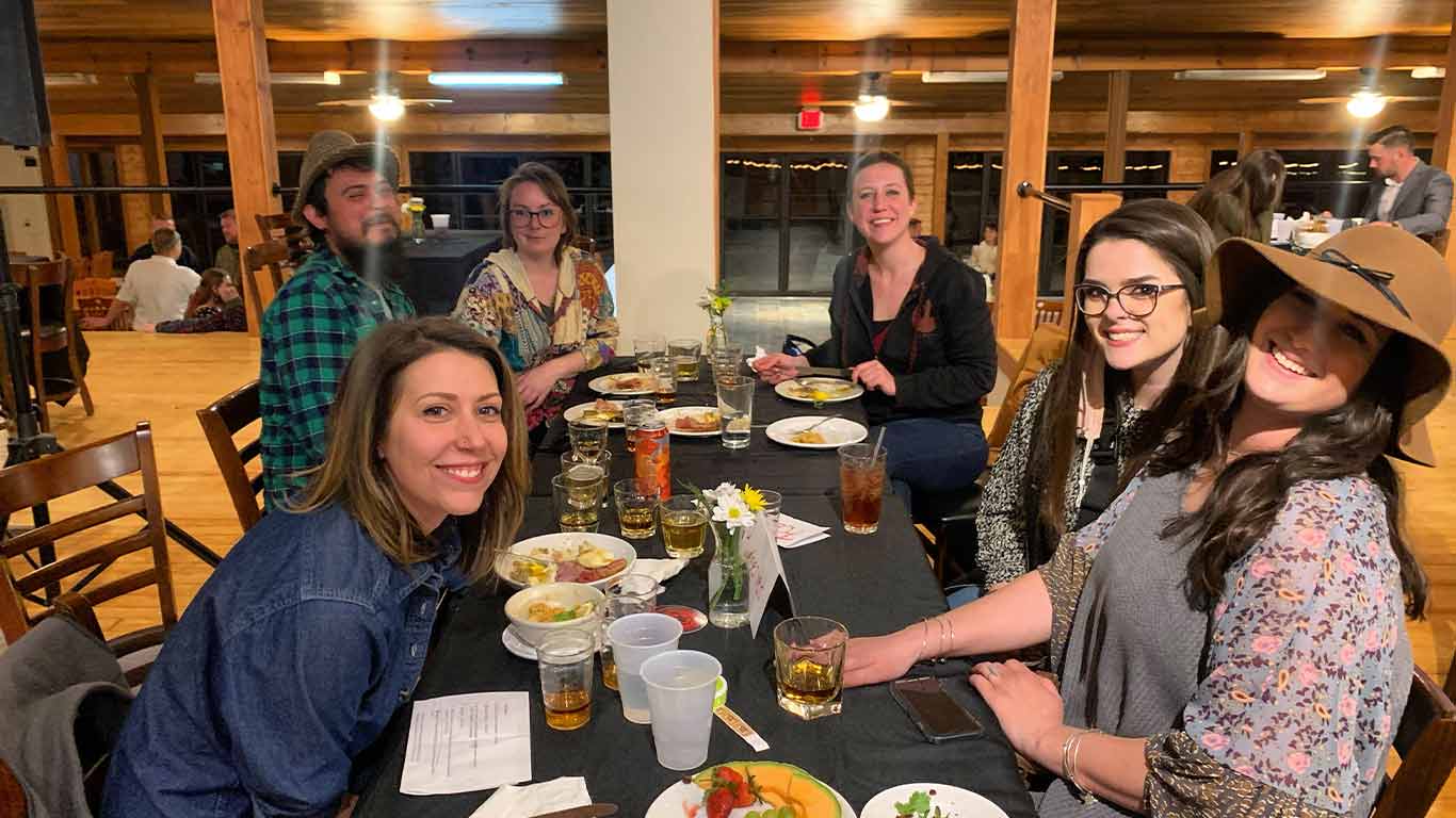 Guests eating dinner at Bourbon and Beer Dinner