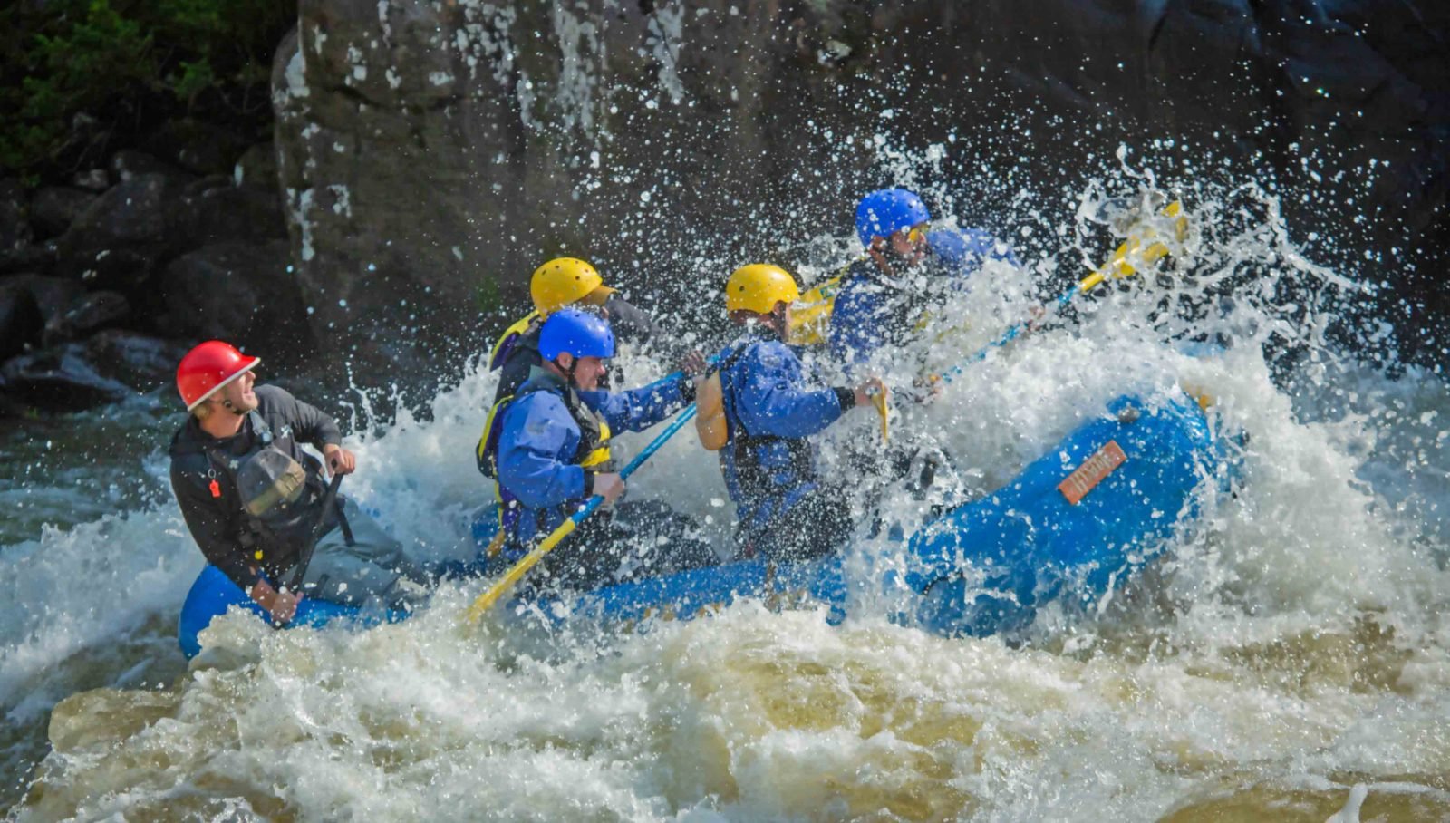 A group of rafters run Pillow Rock Rapid on the Upper Gauley River in a 12' raft upgrade.