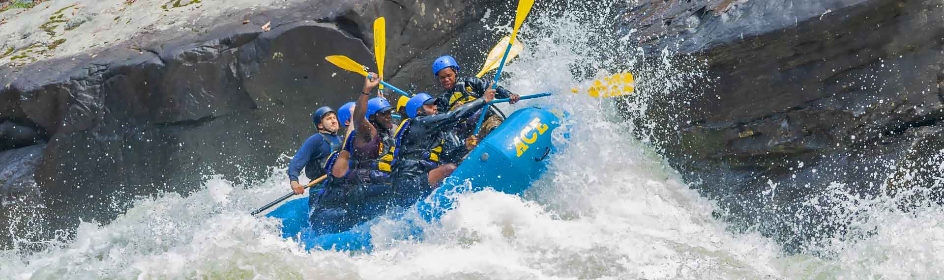 Rafters take on pillow rock rapid on the Upper Gauley River in West Virginia on a guided whitewater rafting trip with ACE Adventure Resort.